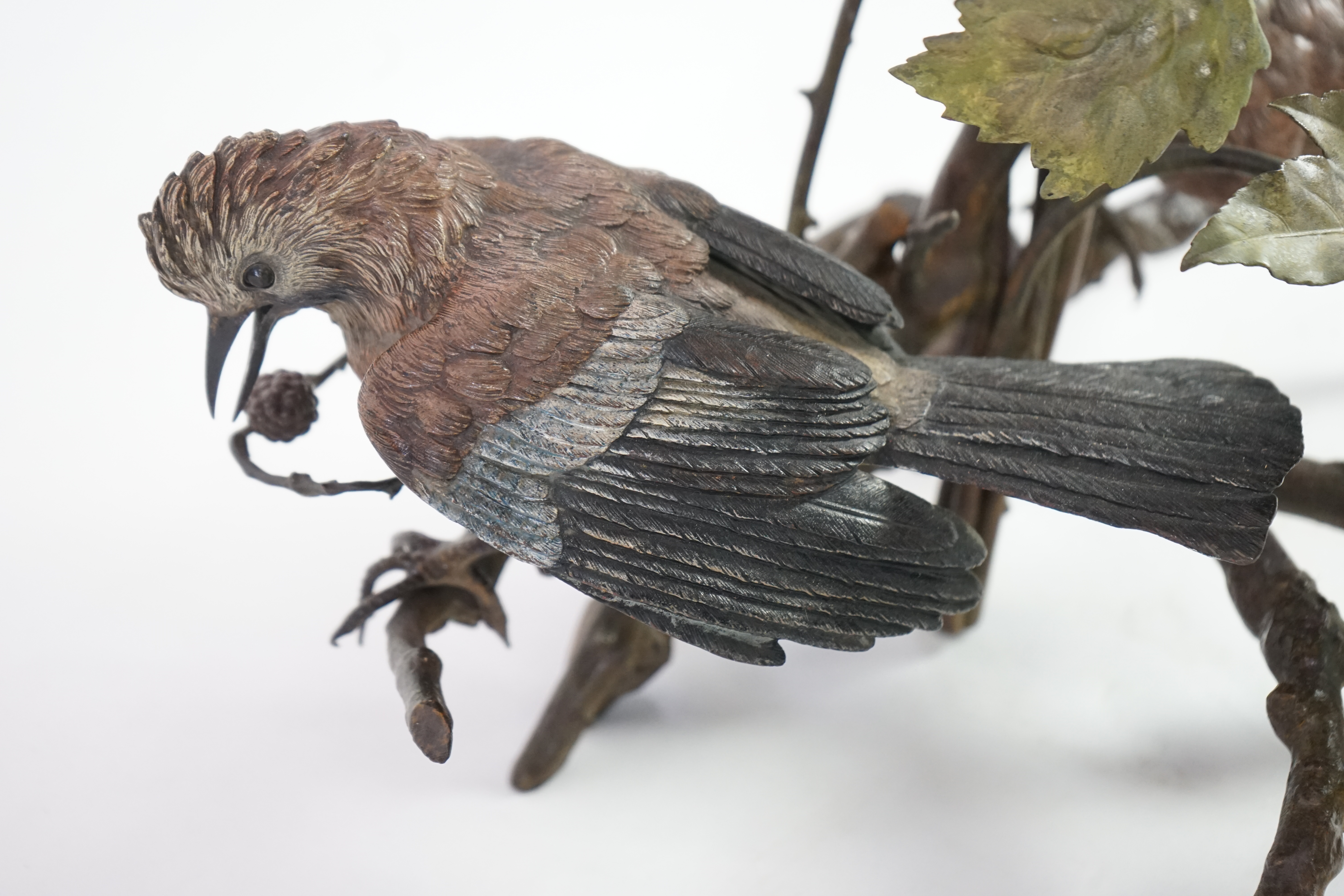 An impressive late 19th century Austrian cold painted bronze group of three jays perched amongst branches